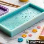 Home 20 홈베이킹 슈가크래프트 기초 - A close-up of a professional sugar crafting workspace featuring soft rolling fondant being gently ro...